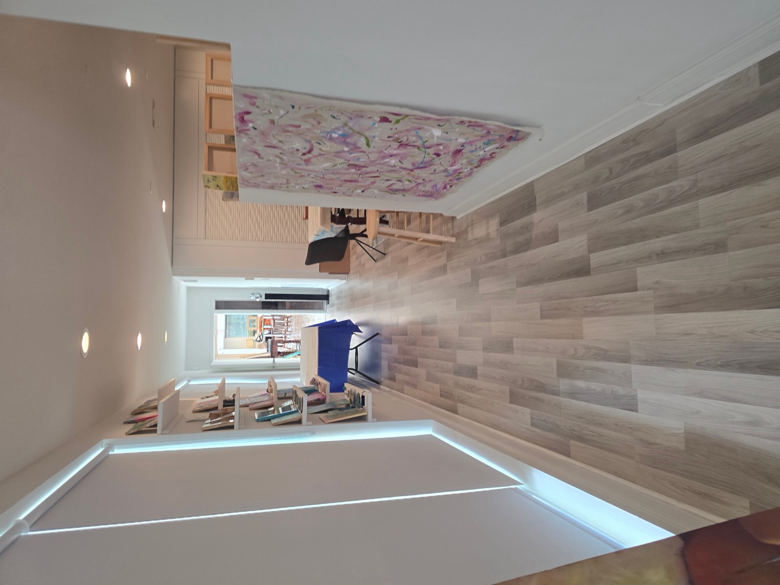 Gallery hallway with shelving