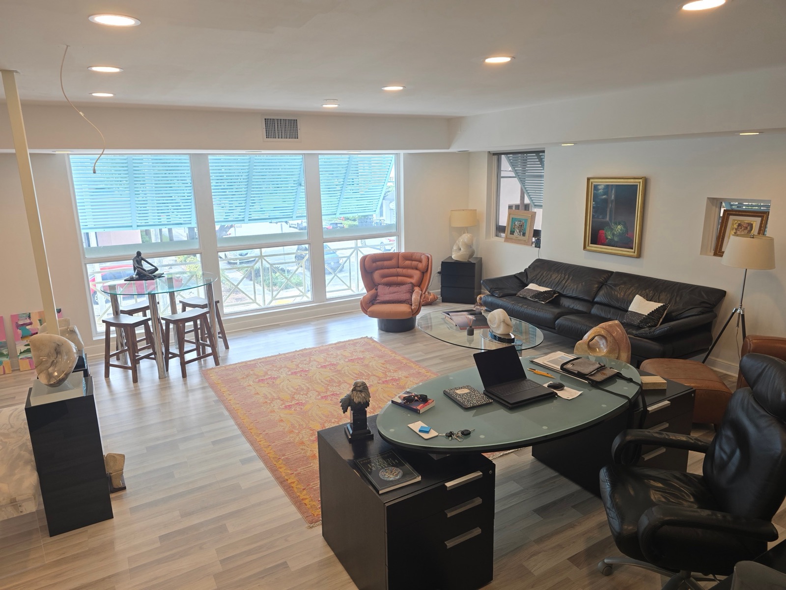 Second floor main room at 101 SE 2nd Avenue with a wall of windows overlooking the street