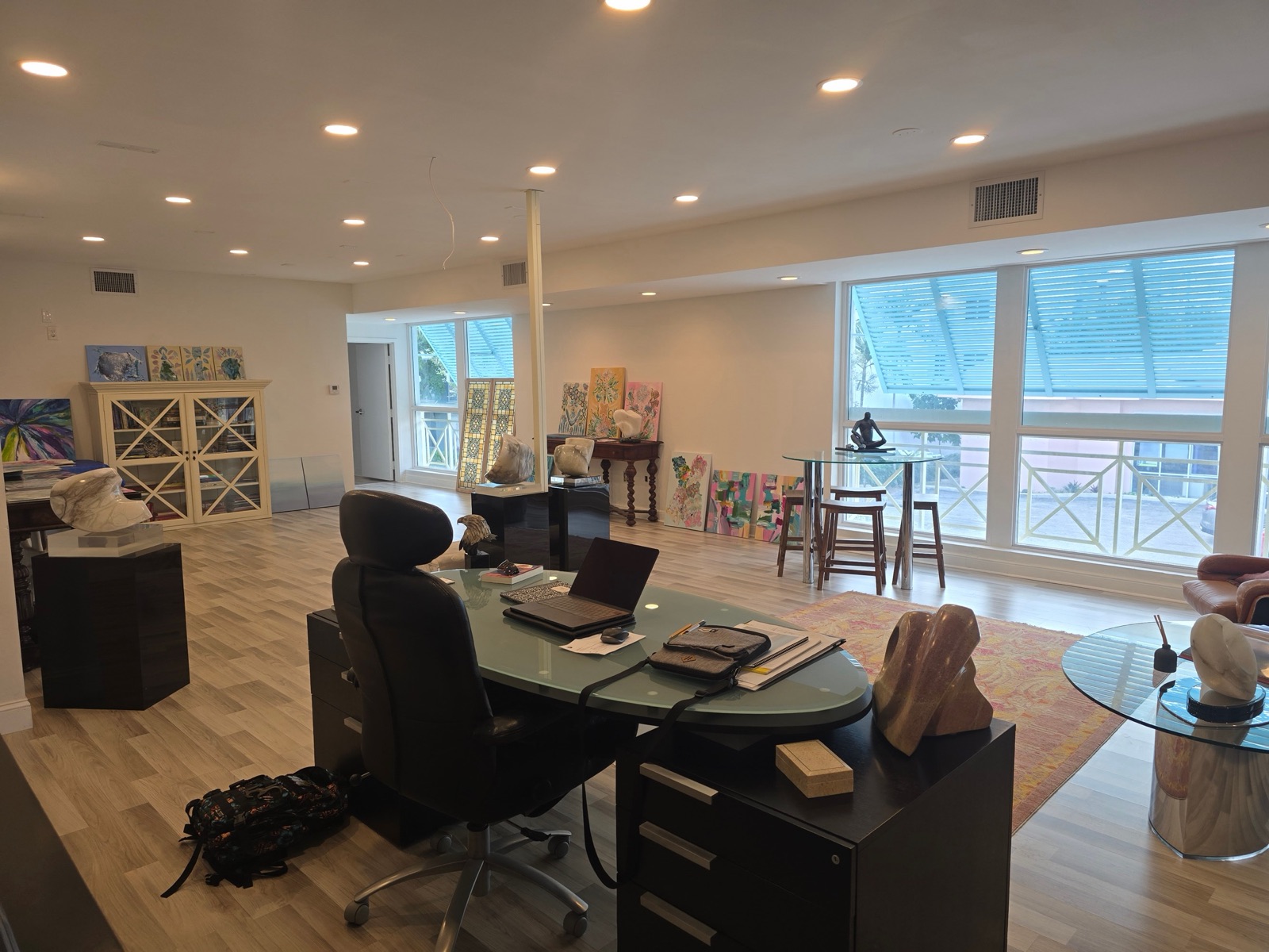 Open second-floor office with windows on two walls